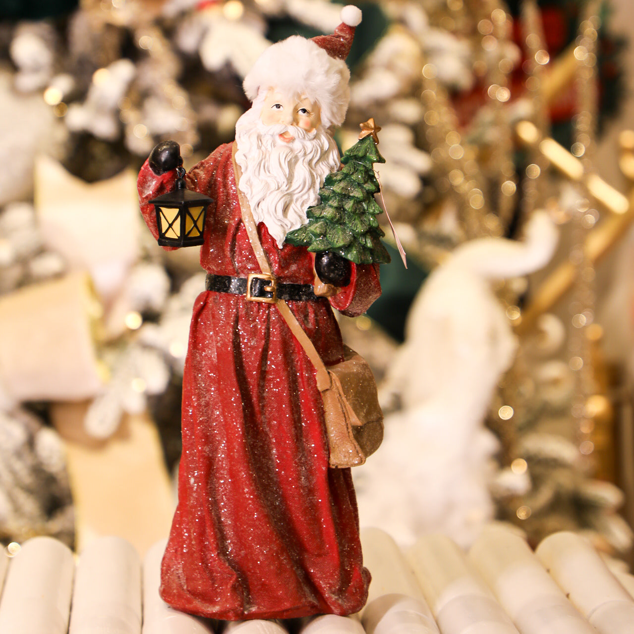 Santa Holding a Tree & a Latern Figurine