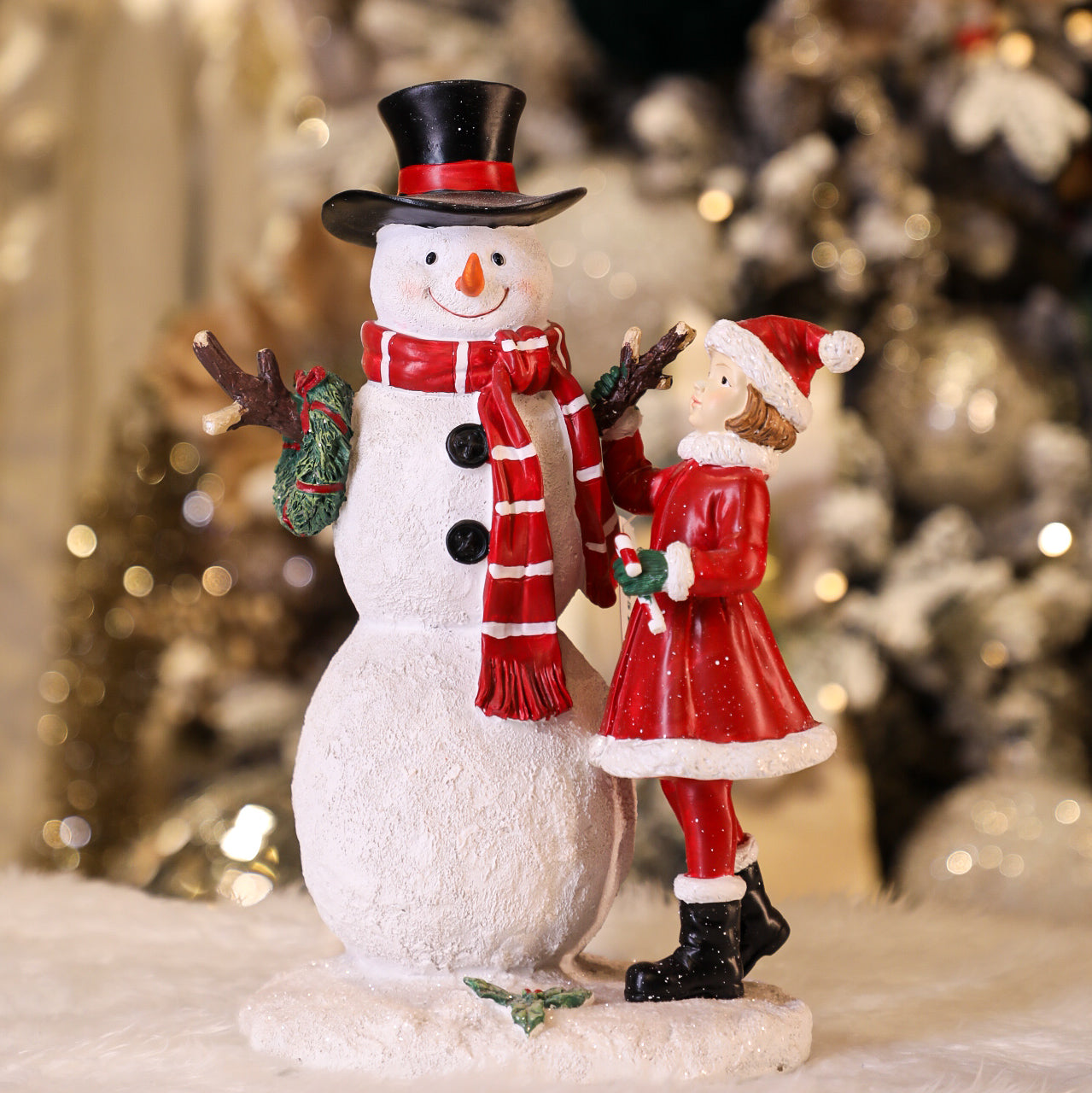 Girl Making Snowman Figurine
