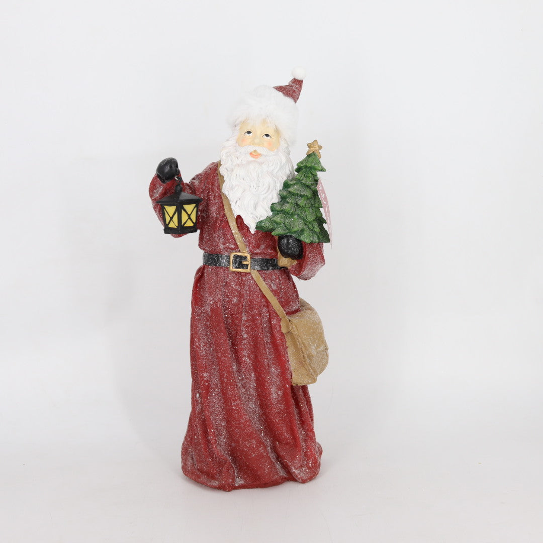 Santa Holding a Tree & a Latern Figurine