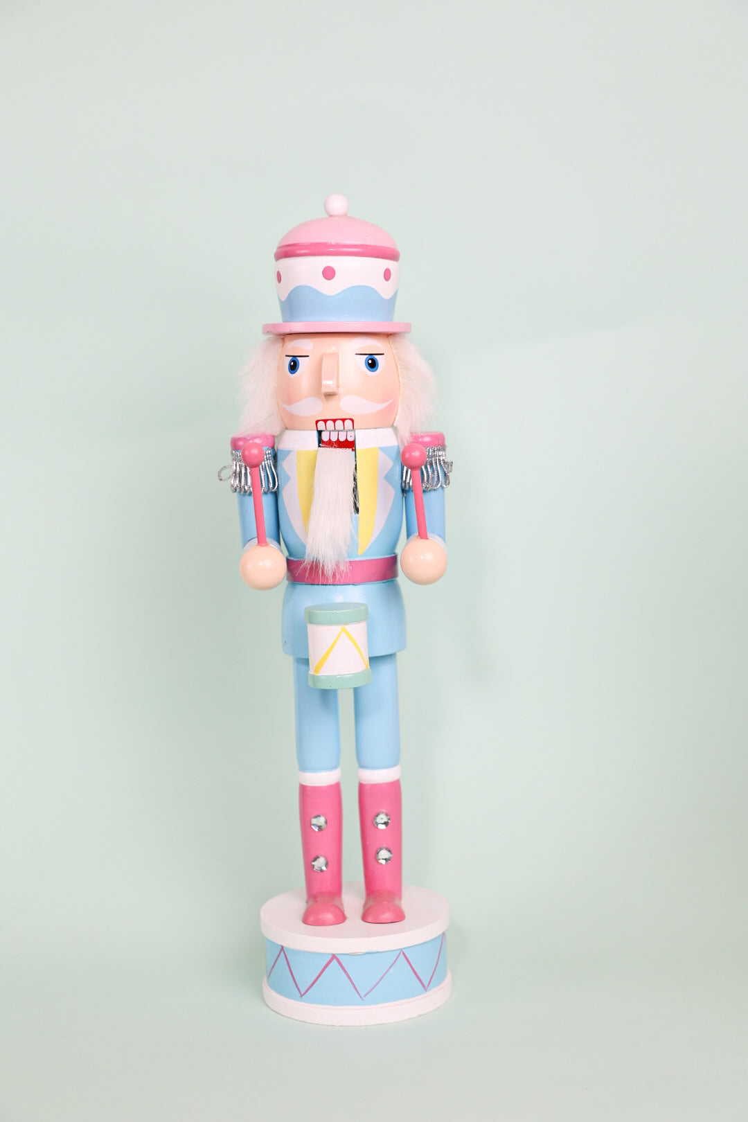 Pastel Nutcracker Holding Musical Instruments